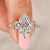 Marquise diamond engagement ring with mixed side stones.
