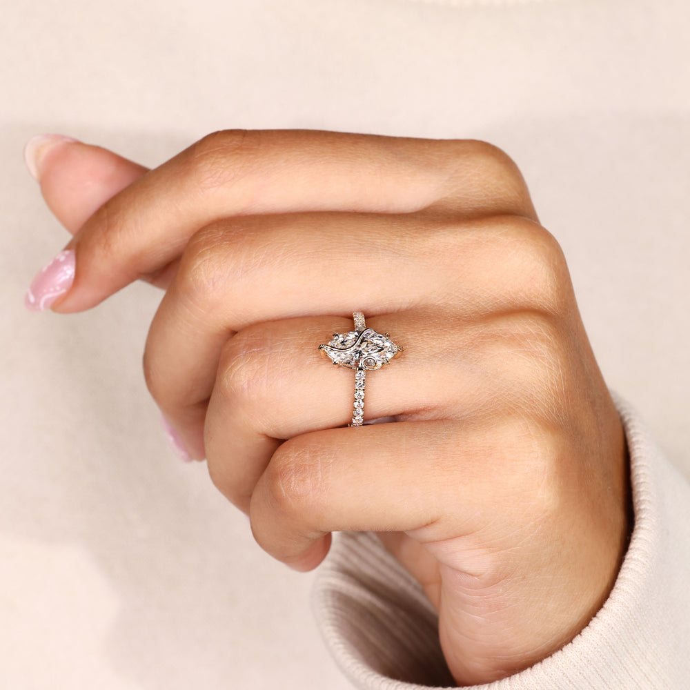 Pave marquise ring with small round diamonds.
