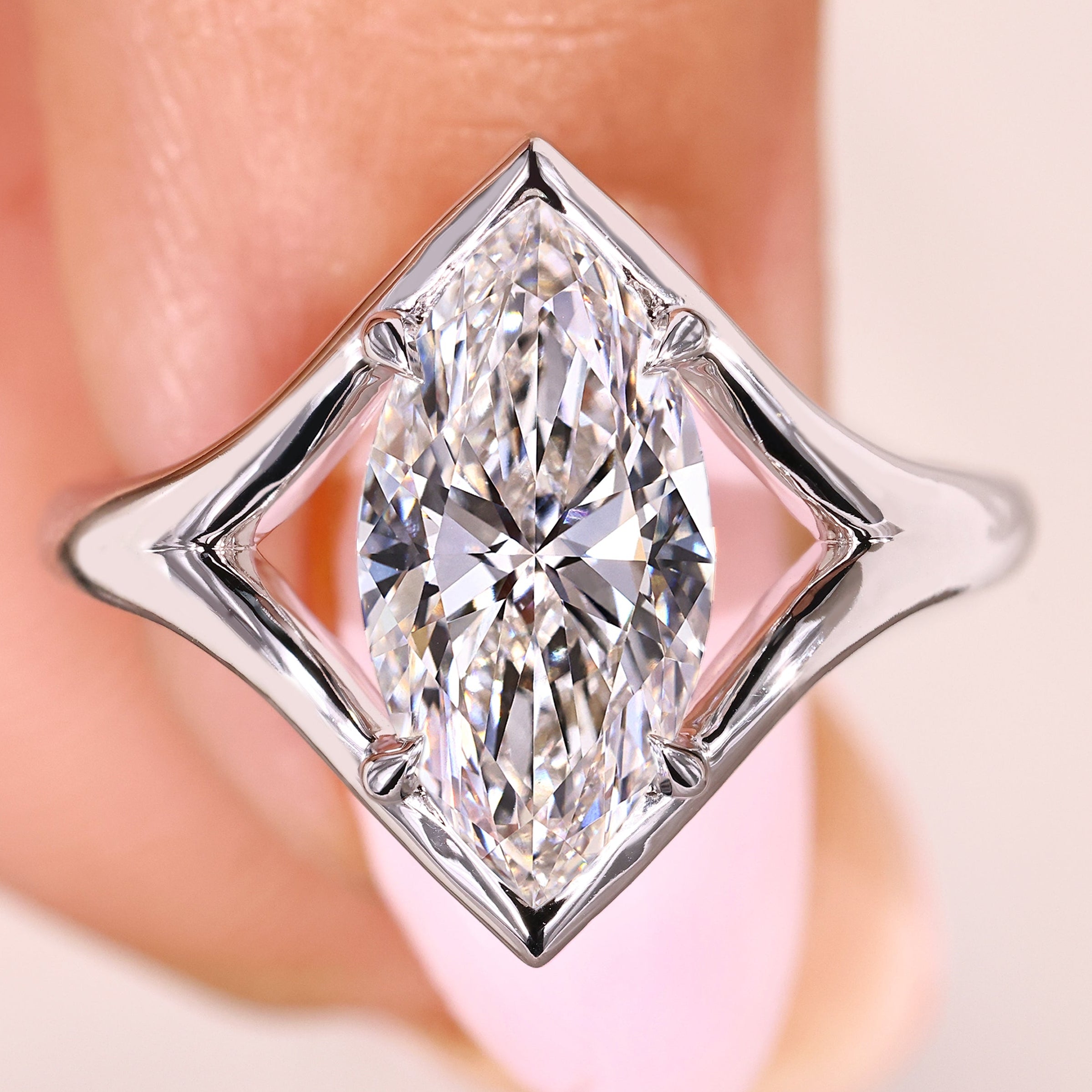 Marquise diamond ring with split shank solitaire setting style
