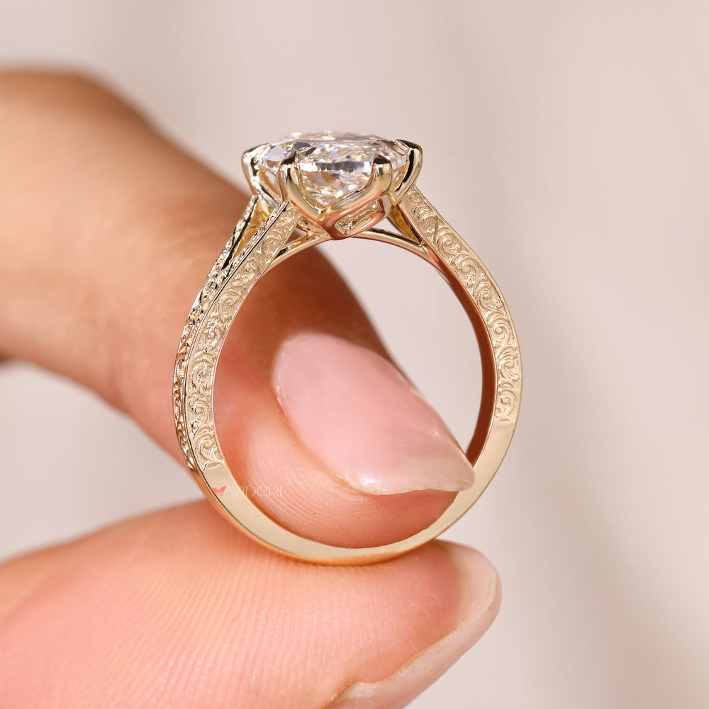 Marquise solitaire ring with tulip basket style.
