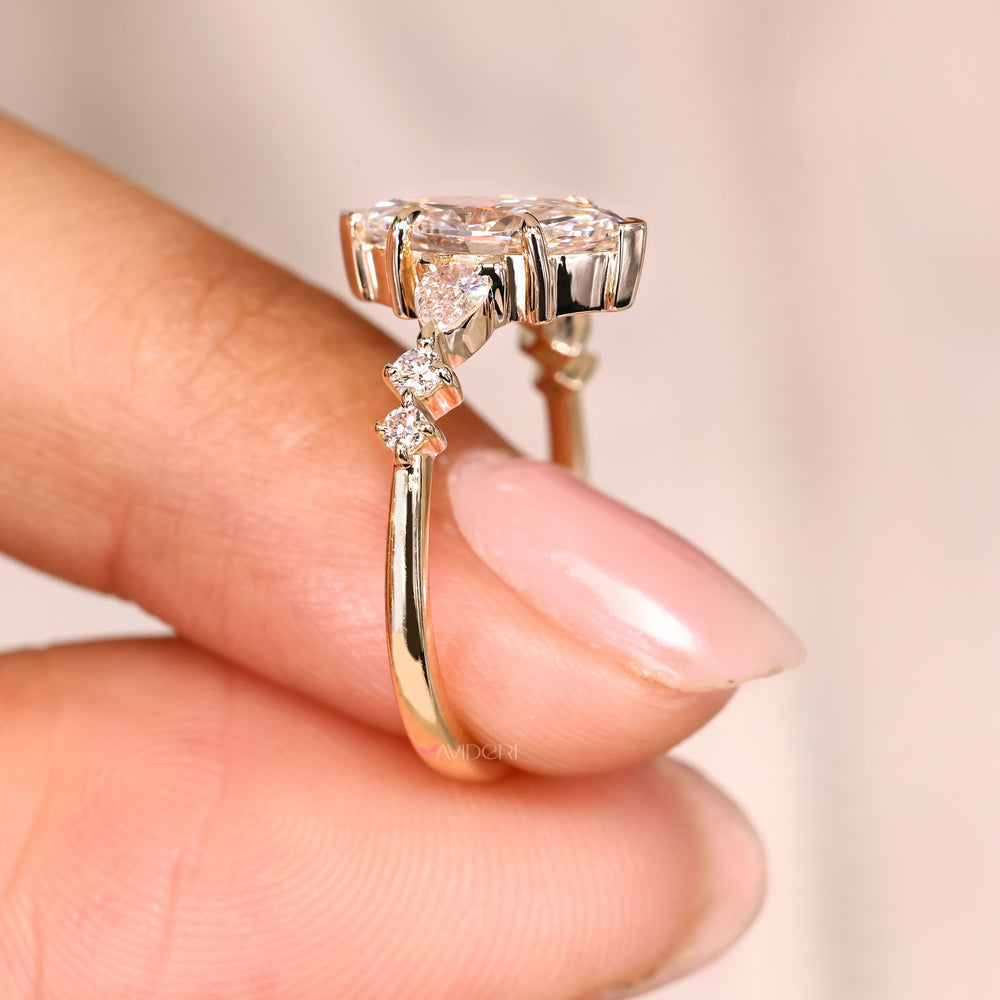 Marquise diamond ring with v and claw prong set.
