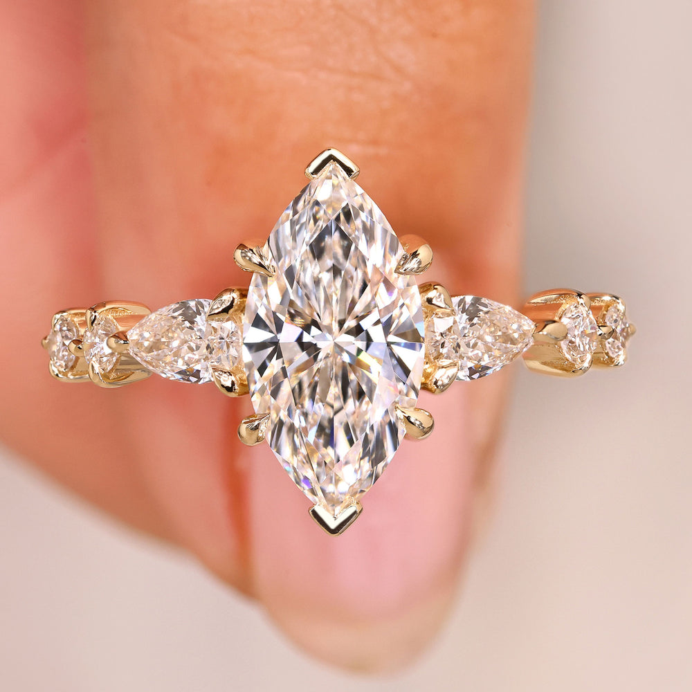 Marquise diamond ring with pear round pave style.
