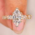 Marquise diamond ring with pear round pave style.
