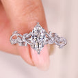 Marquise diamond ring with leaf inspired prong setting.
