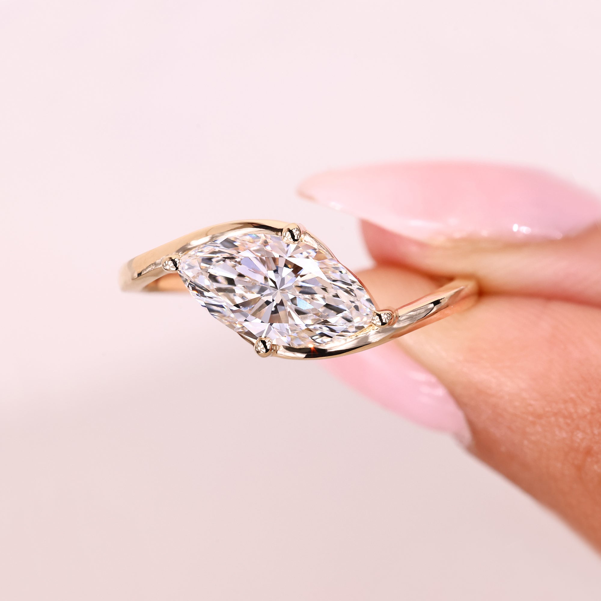 Marquise ring with east west and prong style.
