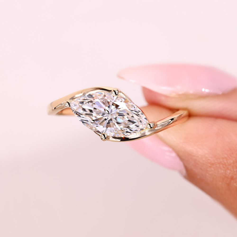 Marquise ring with east west and prong style.
