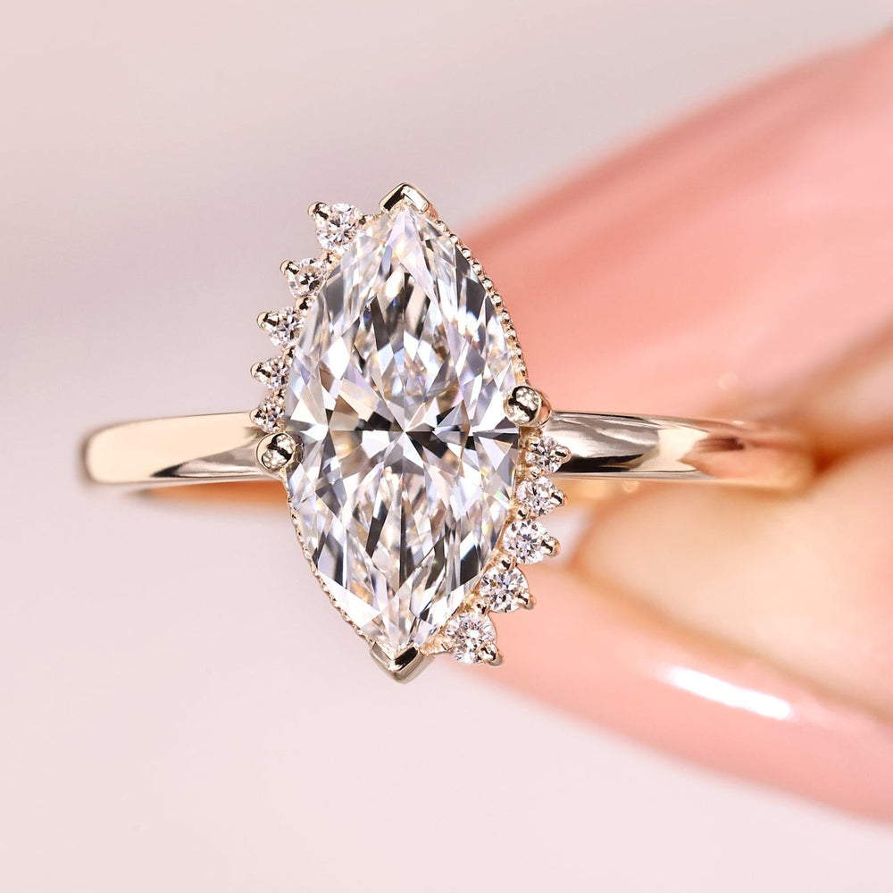 Handmade marquise diamond ring with cluster design.
