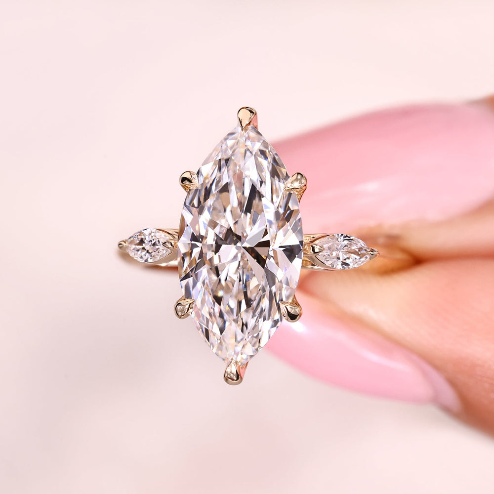 Lab grown marquise diamond ring with secure six claw prongs.