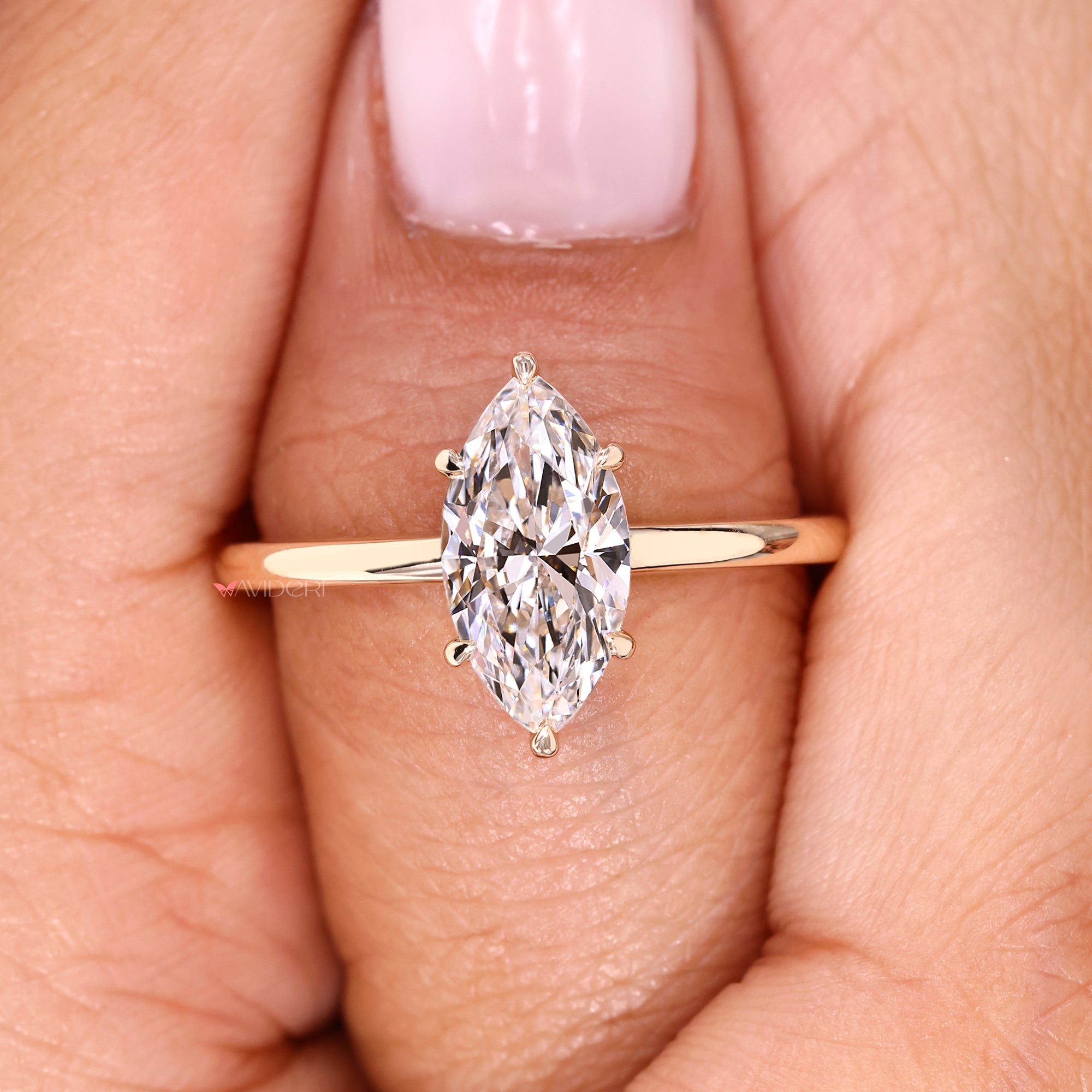 Marquise cut diamond ring featuring handcrafted solitaire design.
