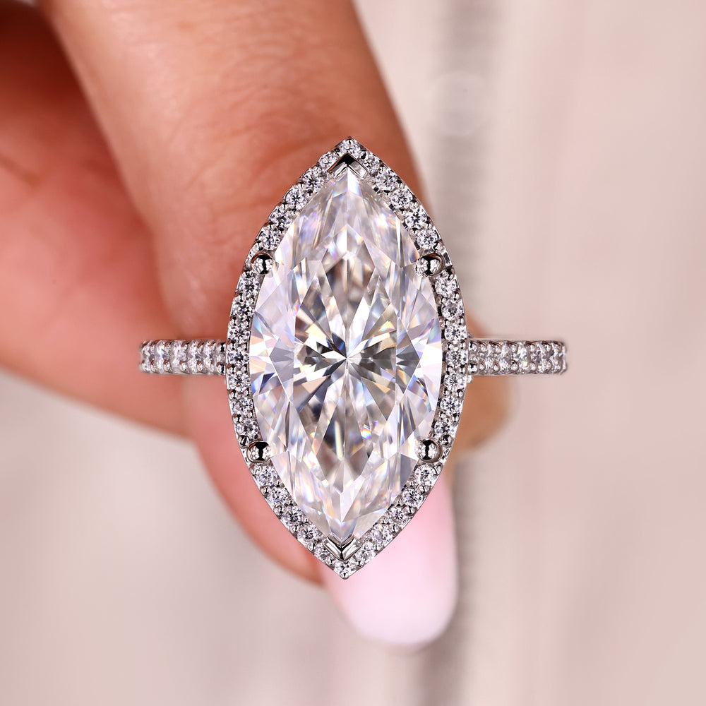 Marquise engagement ring with round cut moissanite halo.