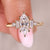Marquise moissanite ring with baguette and round side stones.
