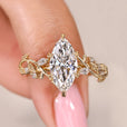 Marquise cut diamond ring with nature inspired filigree style.
