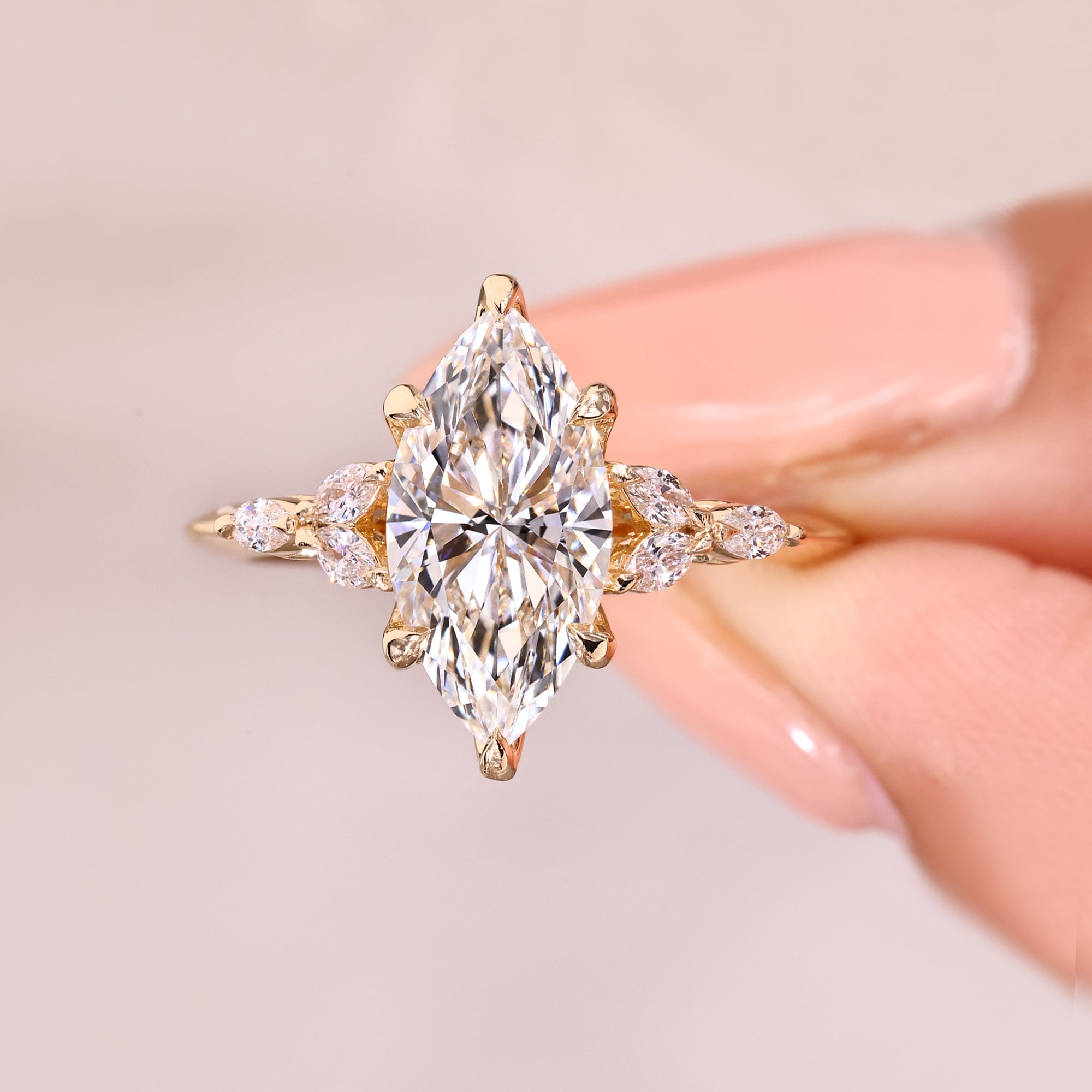 Marquise diamond ring with tulip style prongs.

