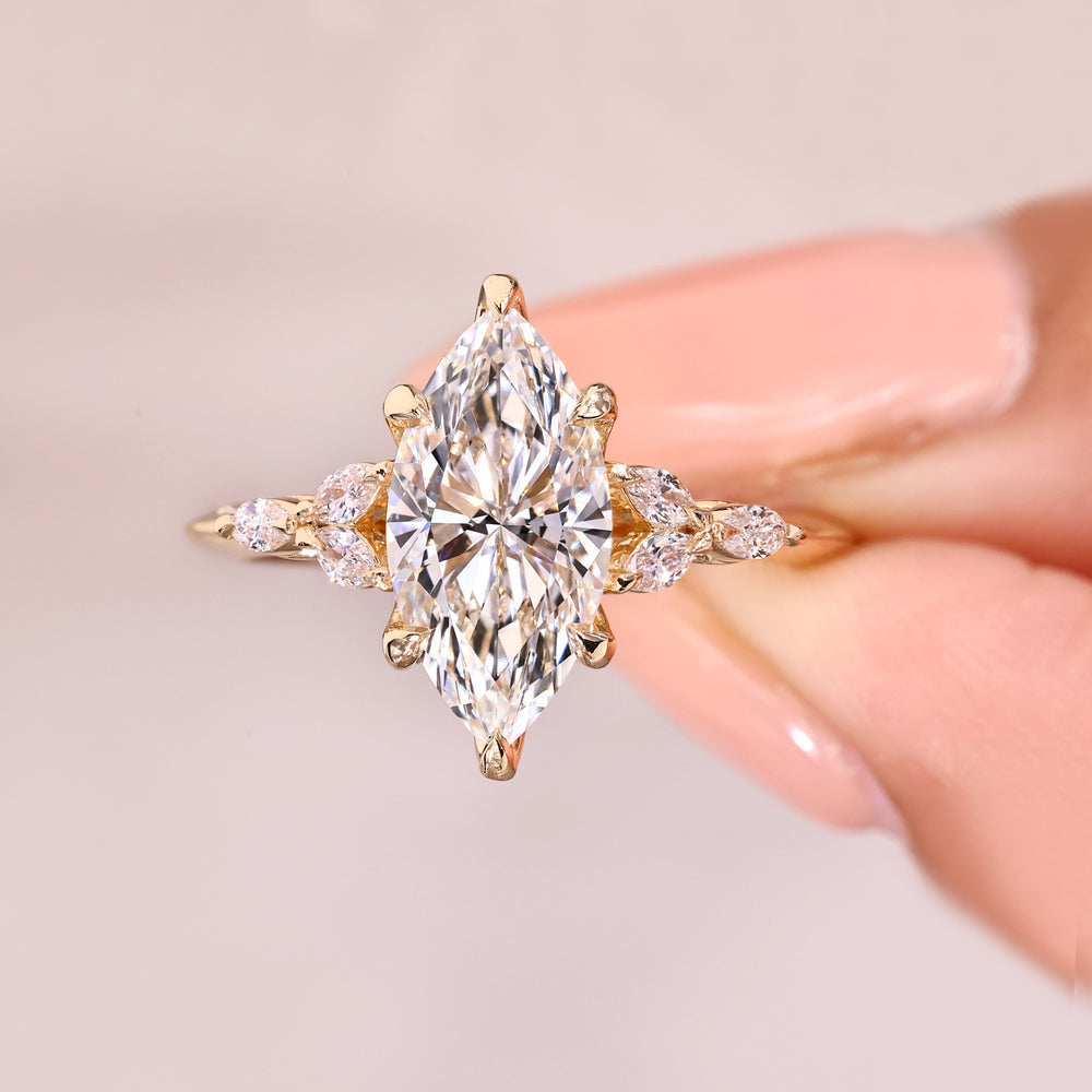 Marquise diamond ring with tulip style prongs.

