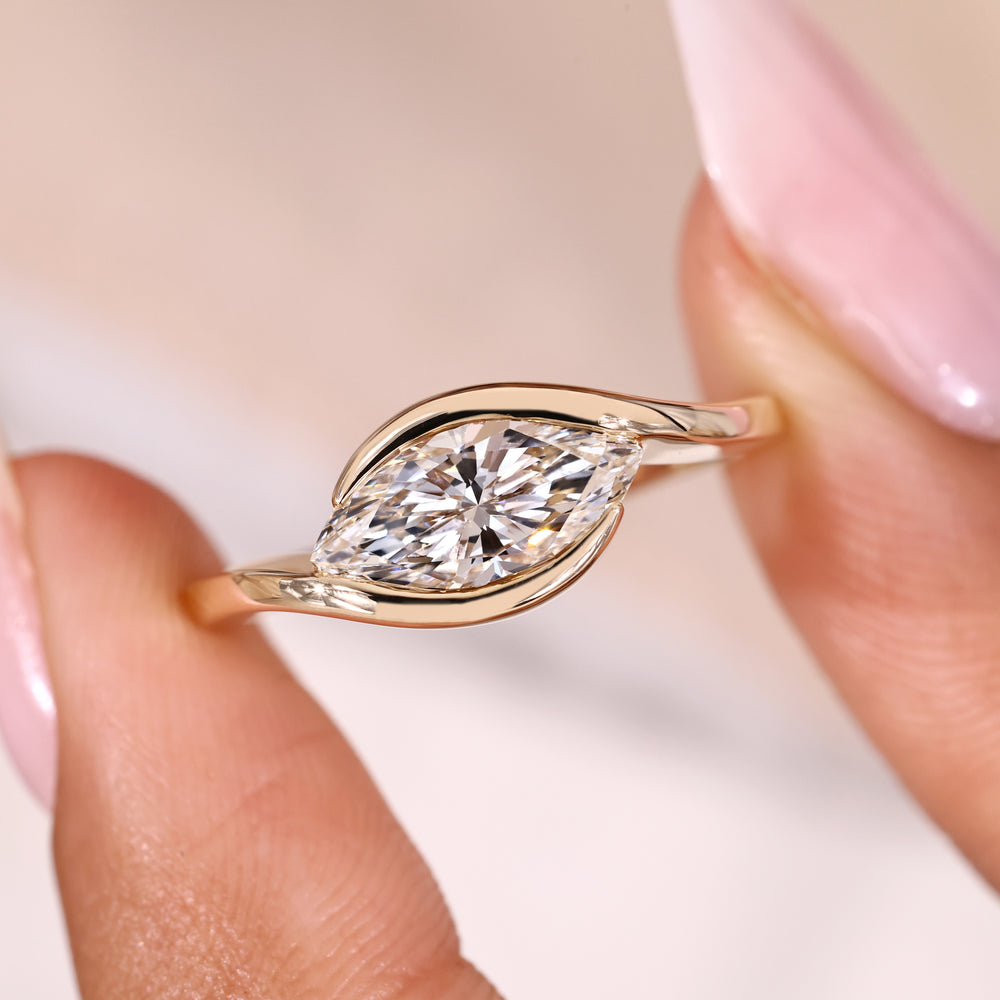 Marquise ring with bypass and solitaire style.
