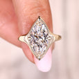 Marquise solitaire diamond ring with sleek profile.