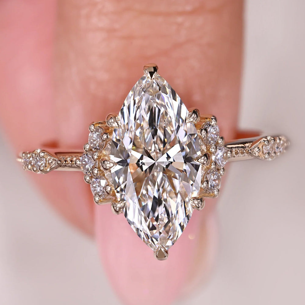 Marquise Engagement Ring set in yellow gold, offering a unique and timeless design.