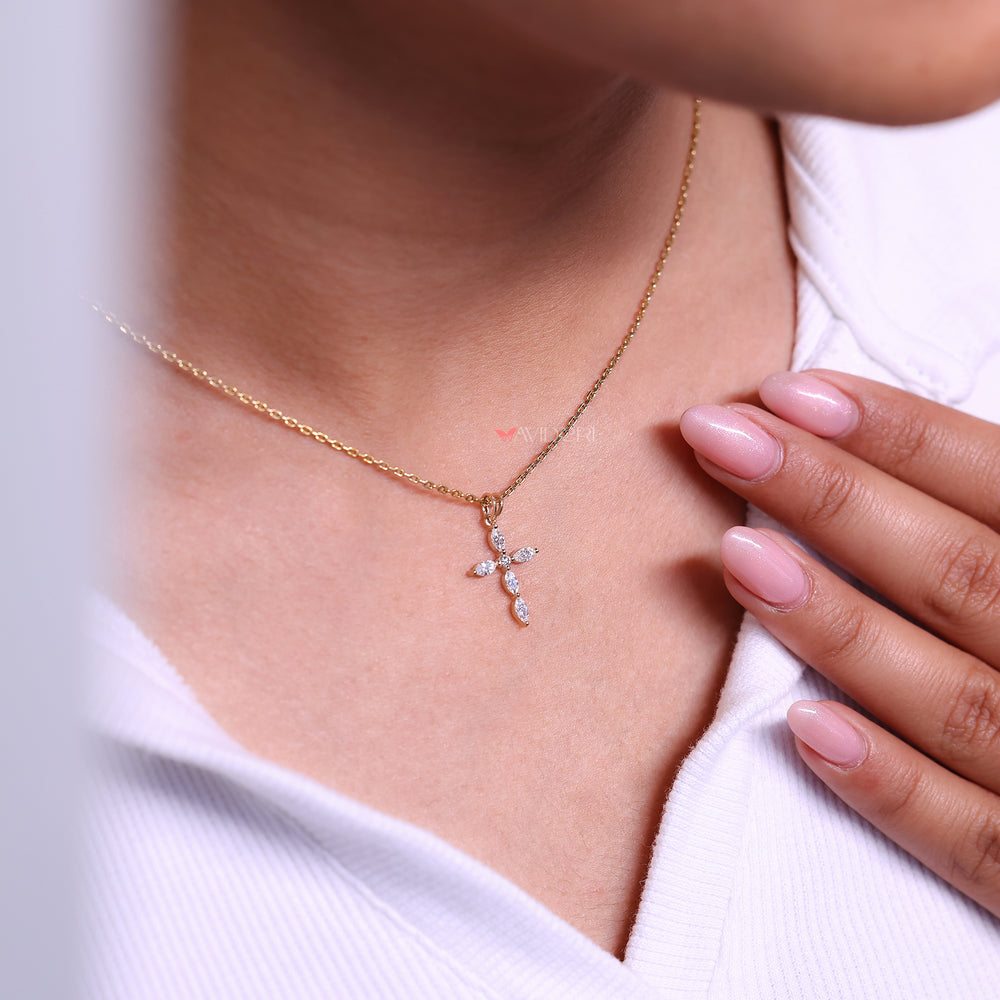 Handmade diamond cross pendant prong set.
