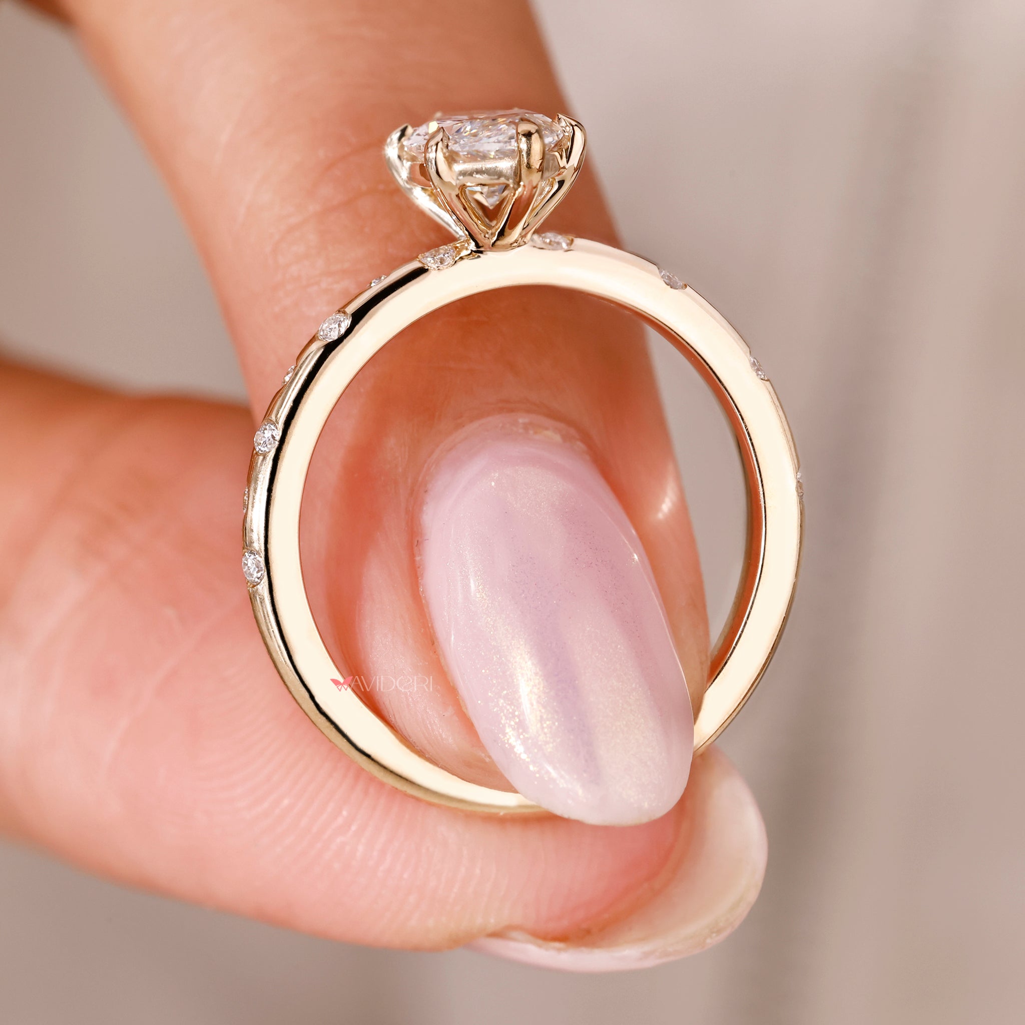 yellow gold marquise diamond engagement ring with 6-claw prong setting.