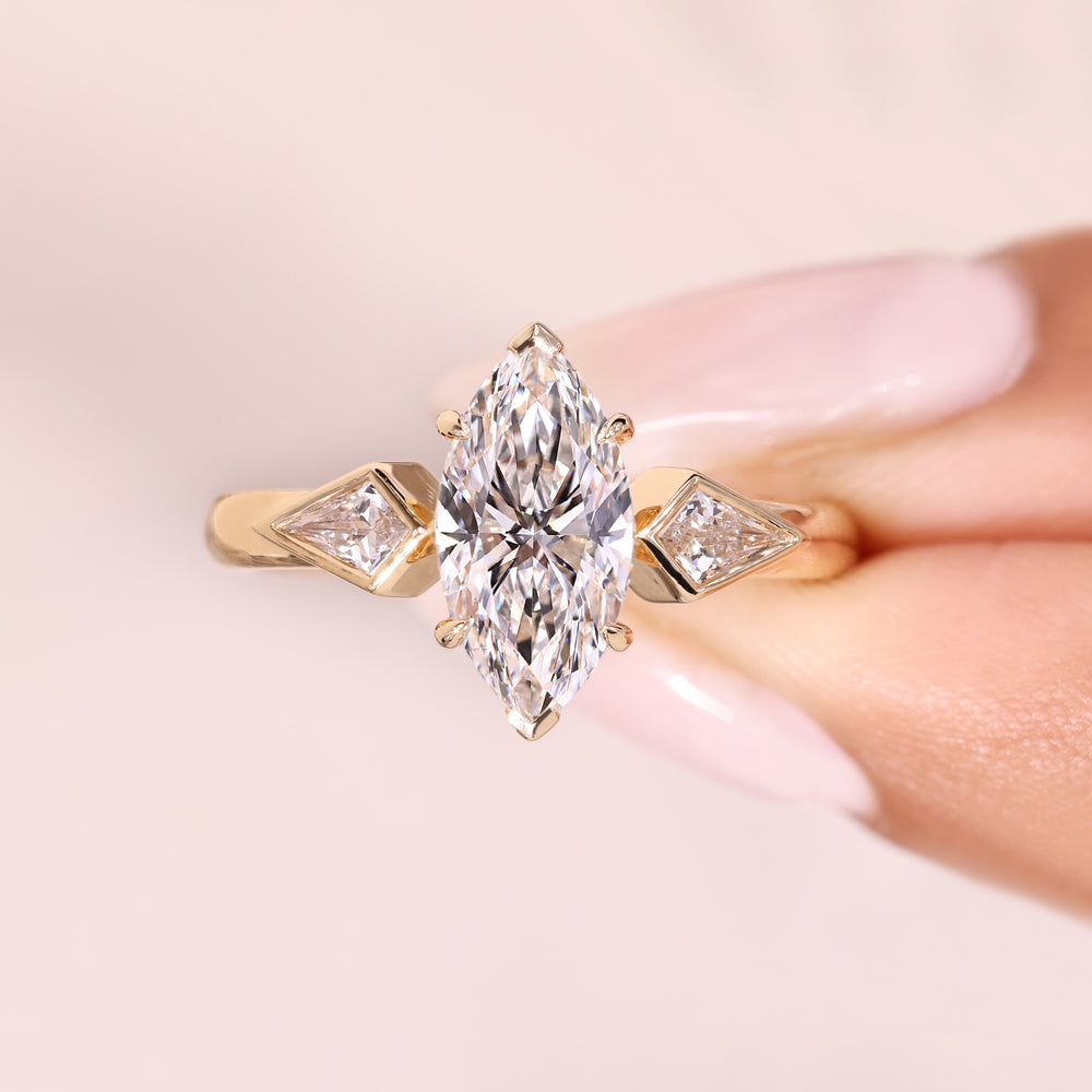 Marquise ring with kite side stones.
