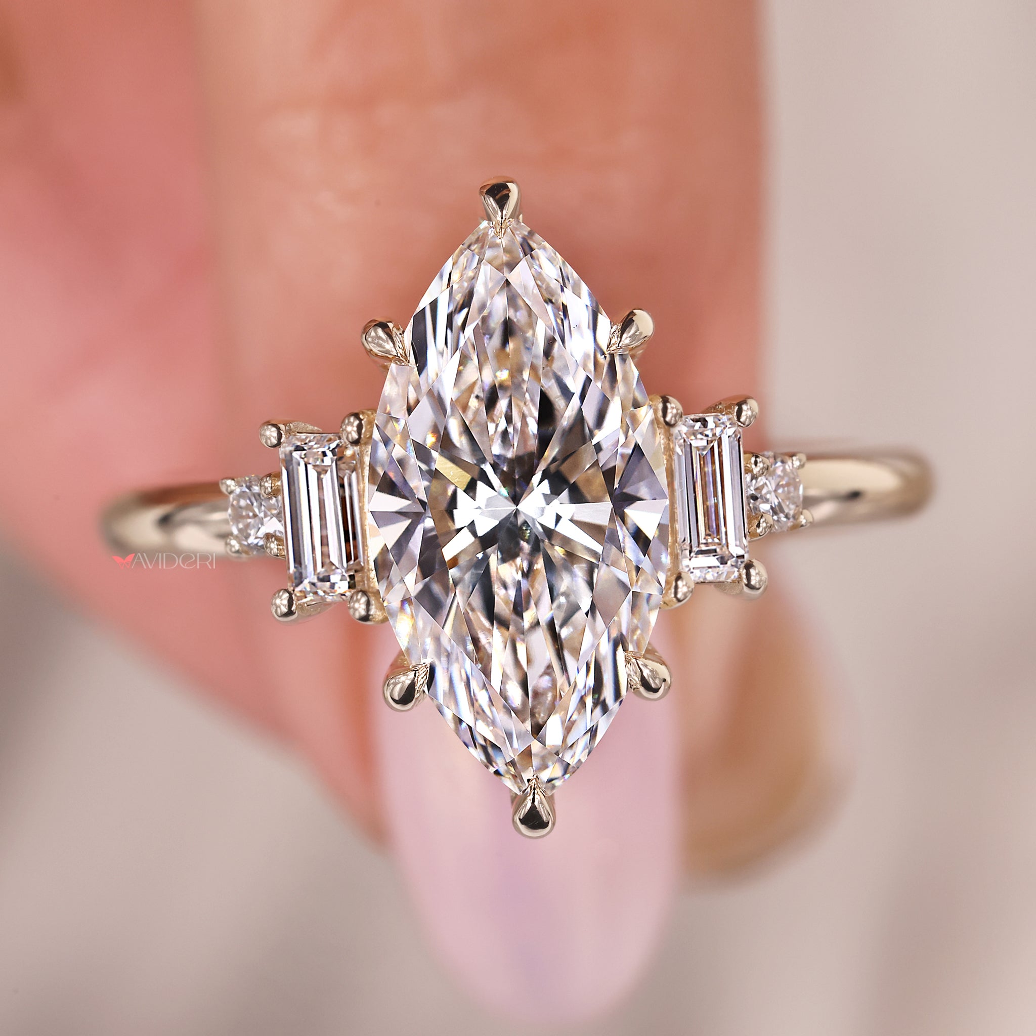 Baguette and round side diamond ring designed for a five-stone custom engagement layout.
