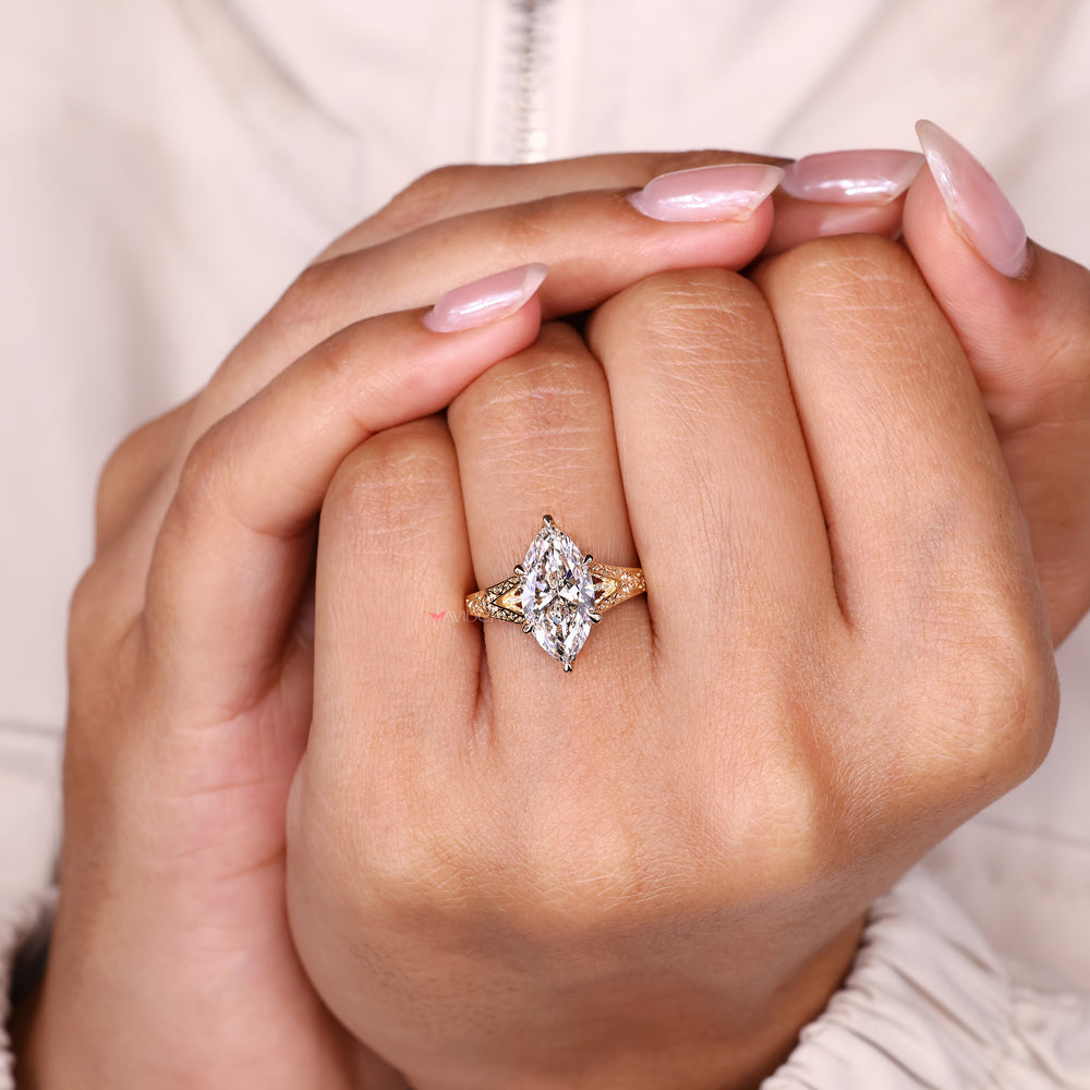 Cathedral setting marquise diamond ring style.
