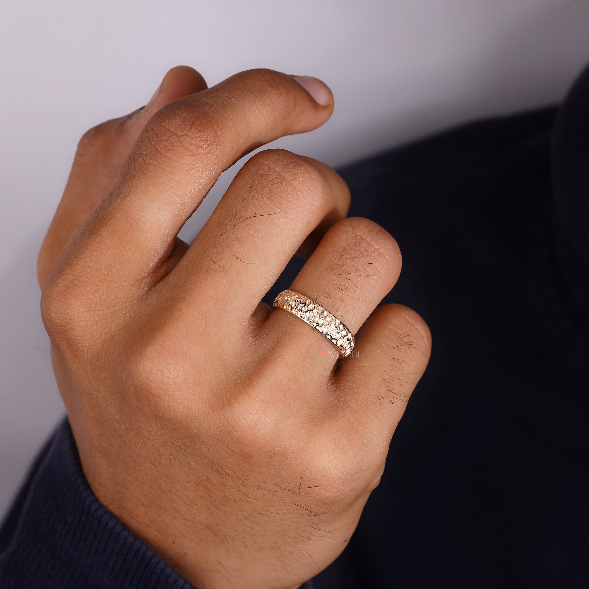 Rustic organic gold mans ring carries earthy tone with handcrafted look.
