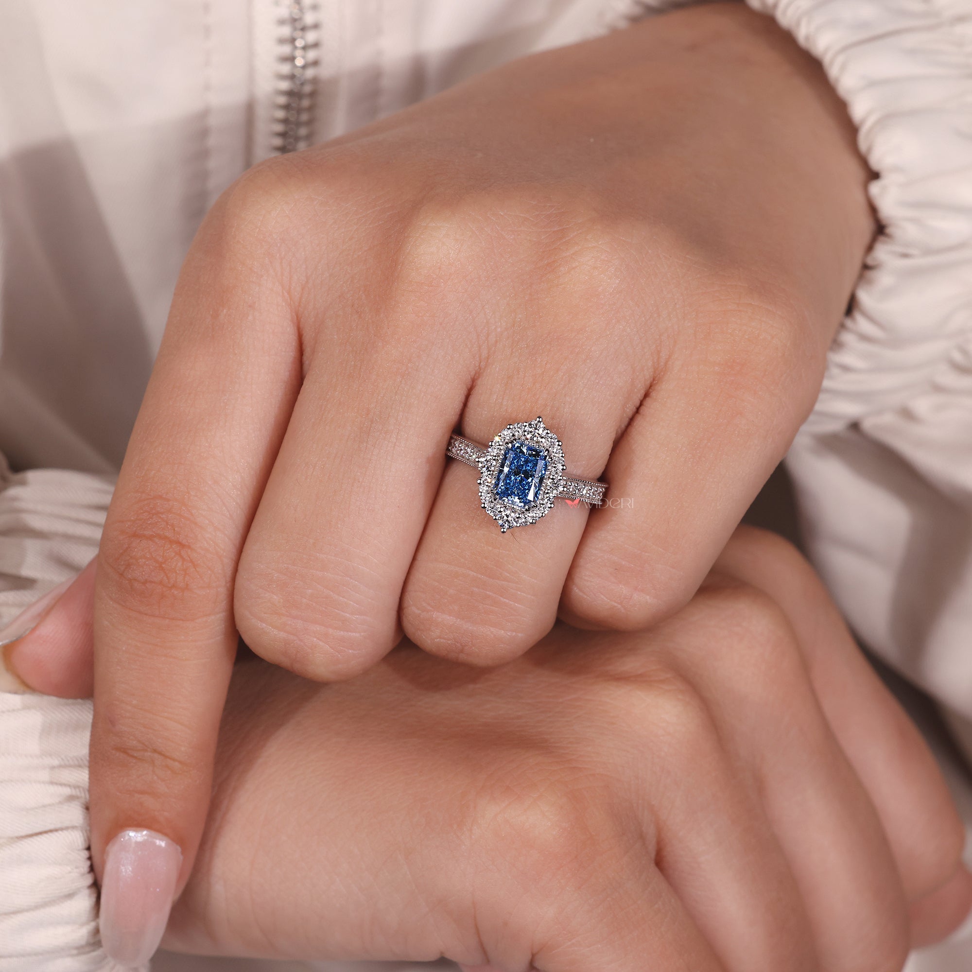 Vintage-style radiant diamond engagement ring with double claw prong setting.