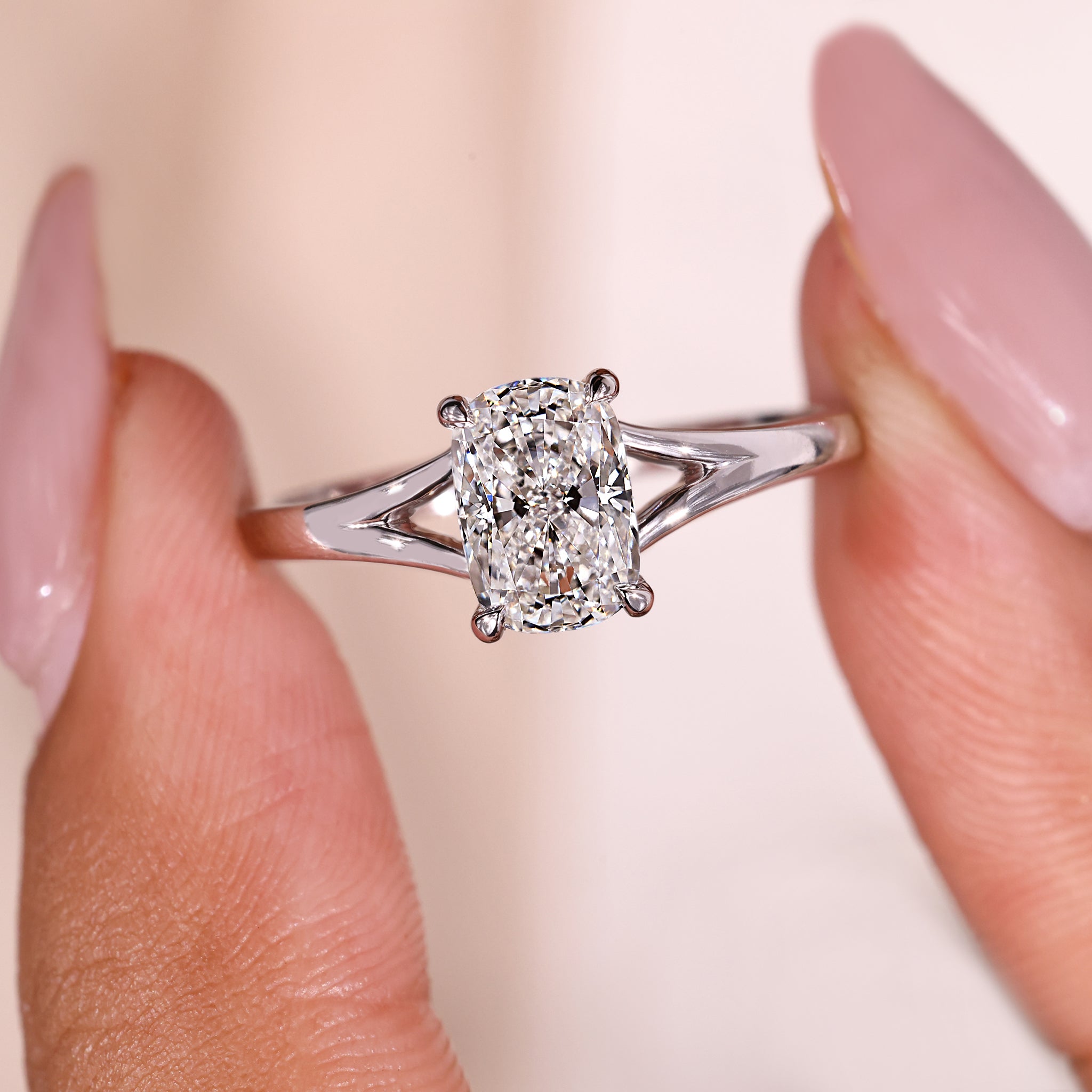 Cushion cut ring in white gold with a 4 claw prong setting.