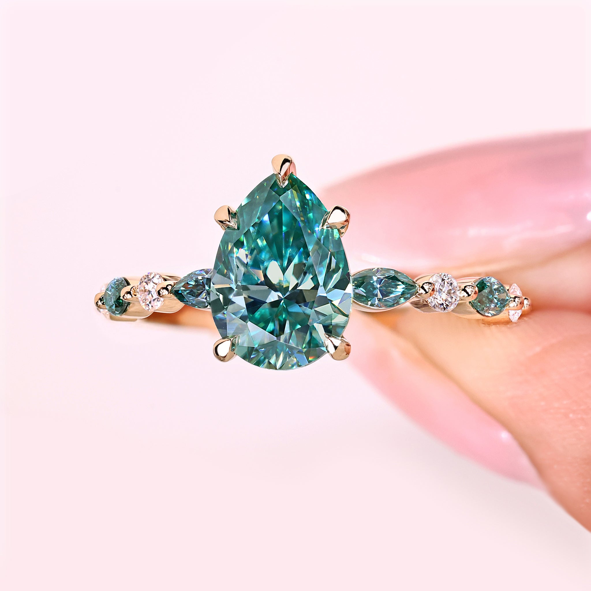 Handmade pear cut moissanite ring design.
