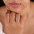 Champagne engagement ring featuring a round cut center stone.
