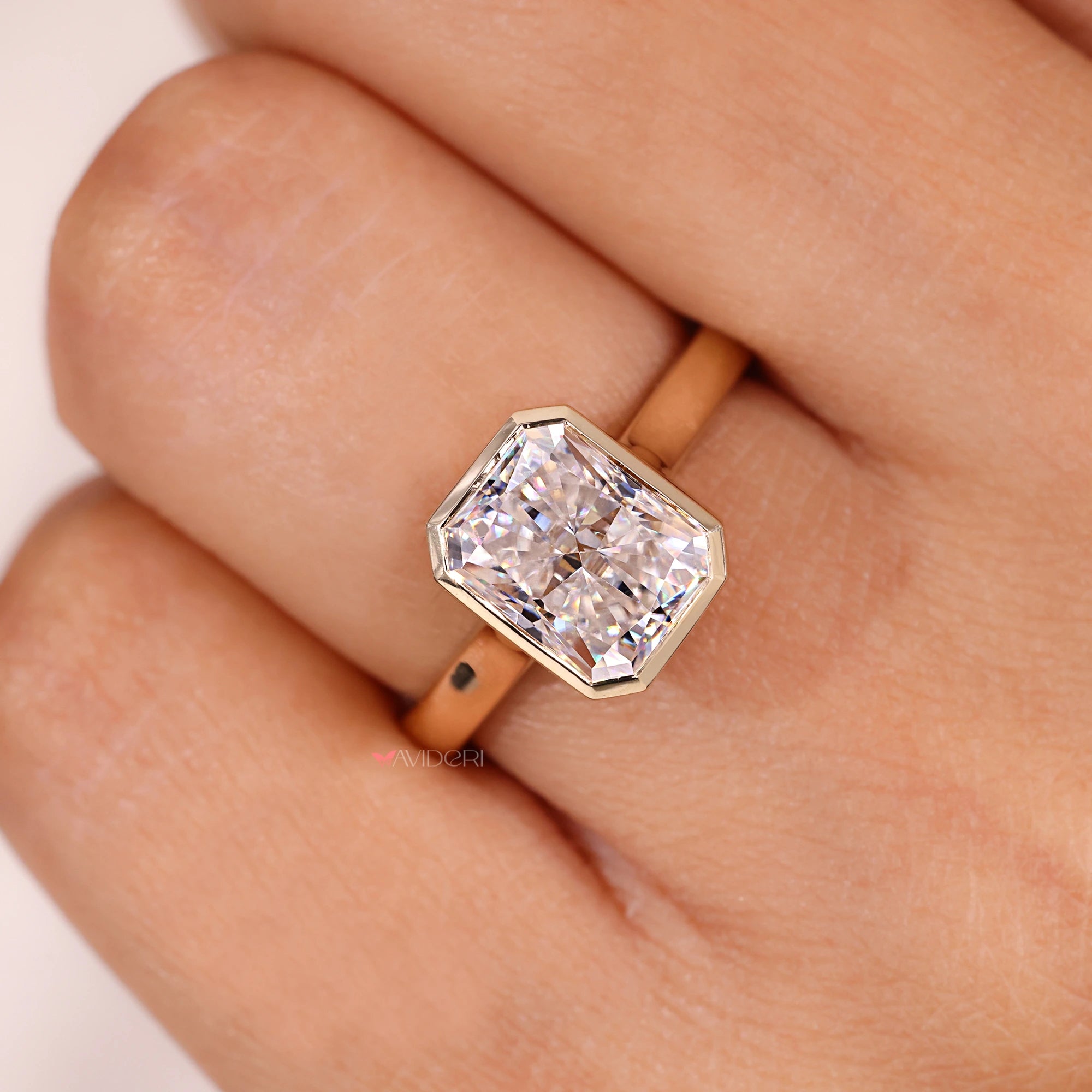 Radiant cut shape adds bright sparkle to the ring.