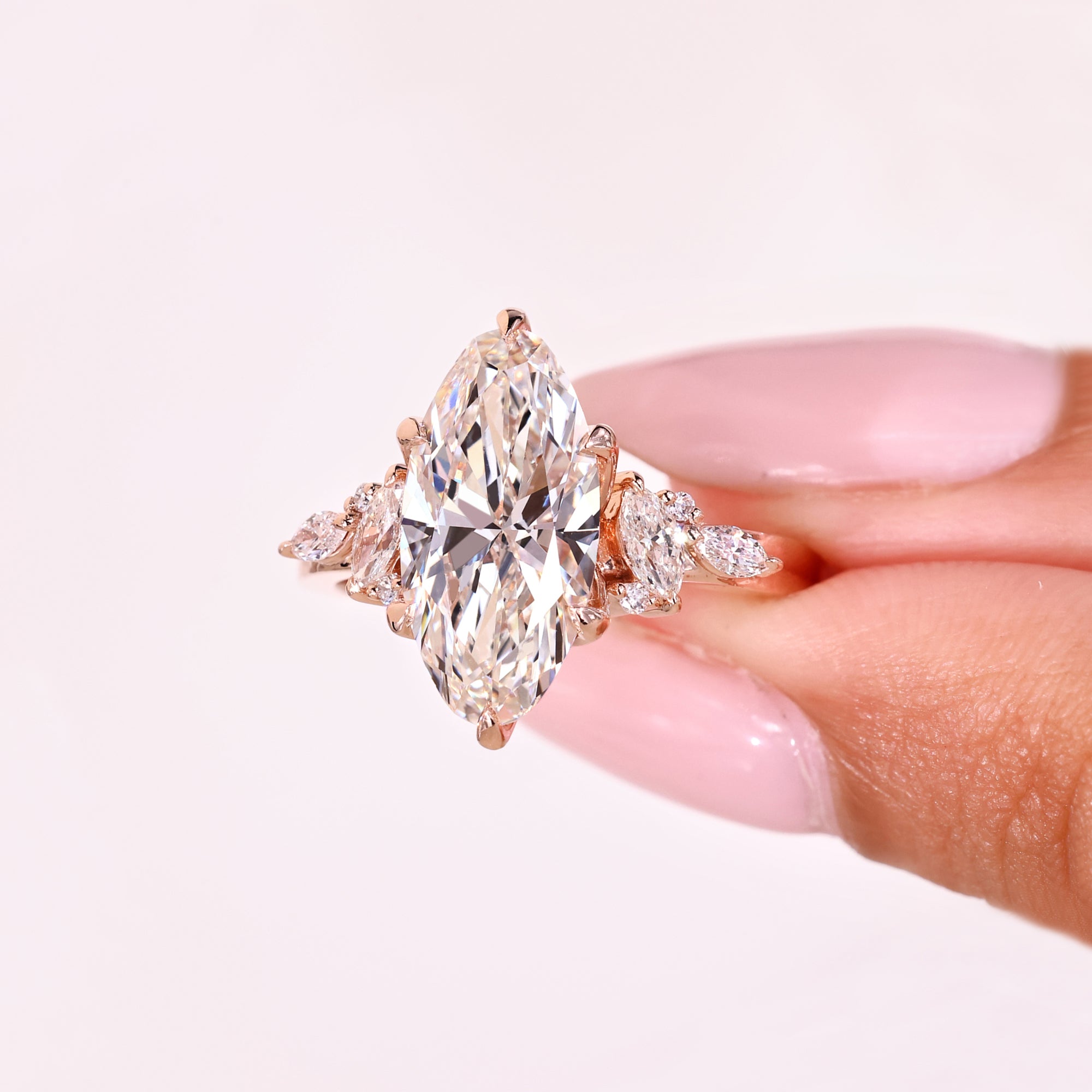Lab grown moval diamond ring with side stones.
