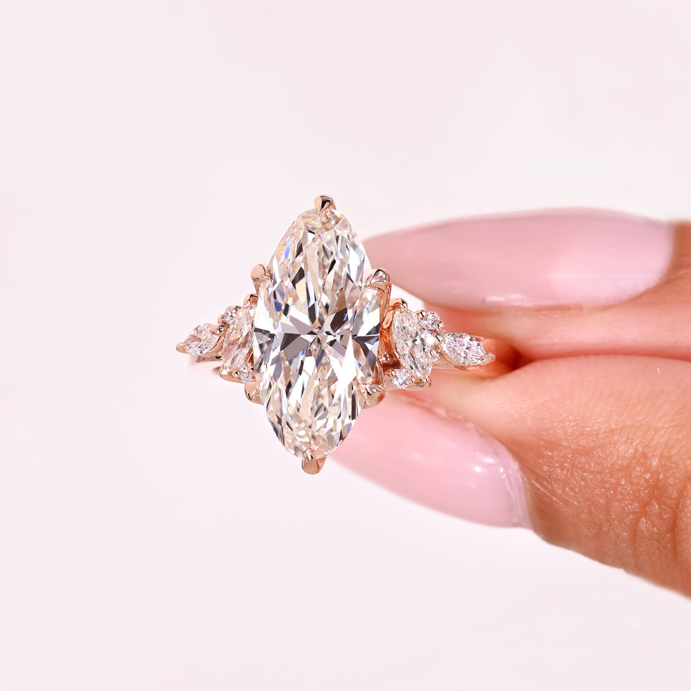 Lab grown moval diamond ring with side stones.
