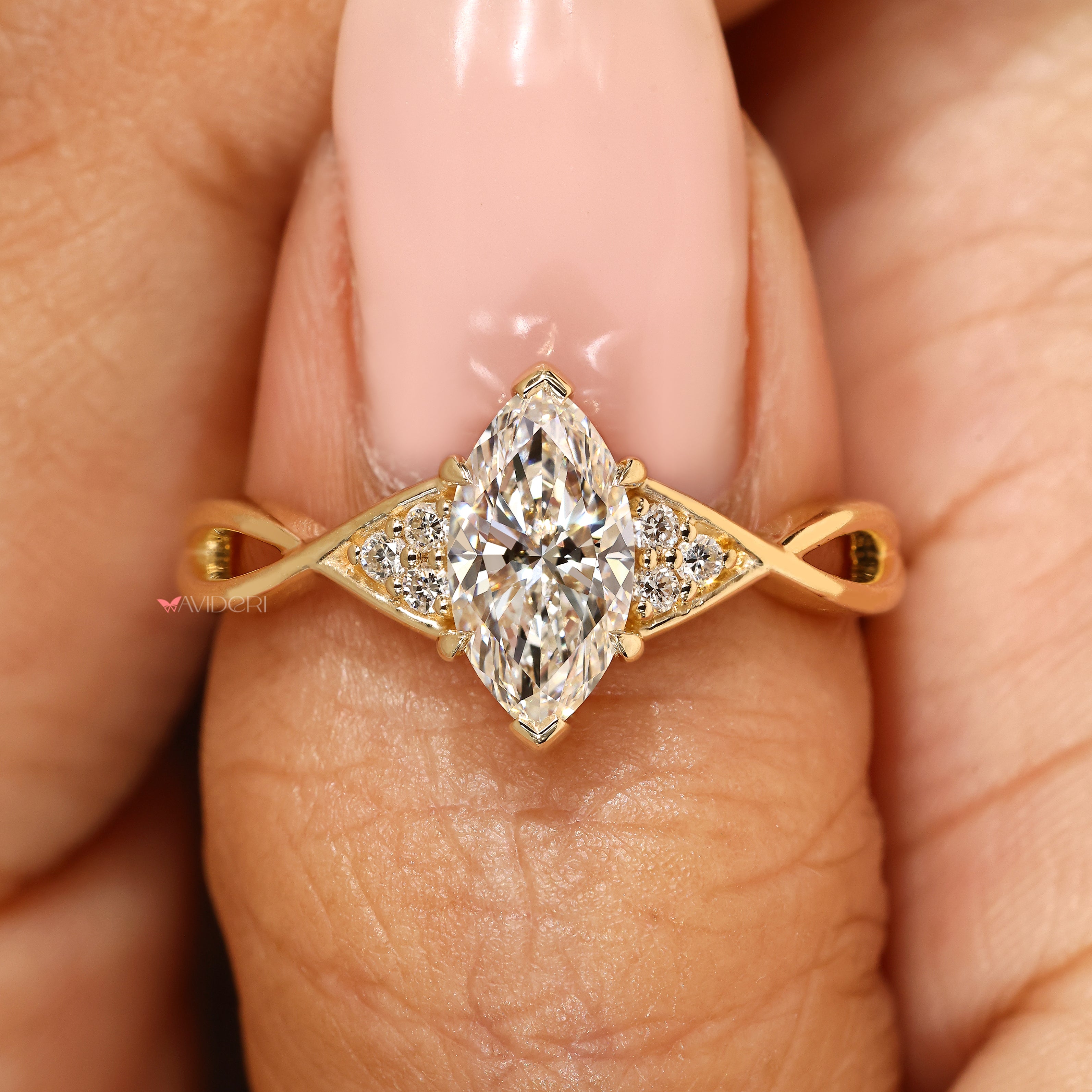 Marquise ring with two V shaped prongs.
