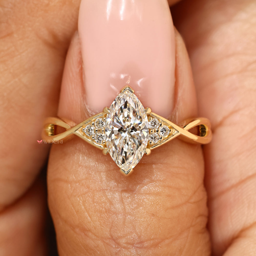 Marquise ring with two V shaped prongs.
