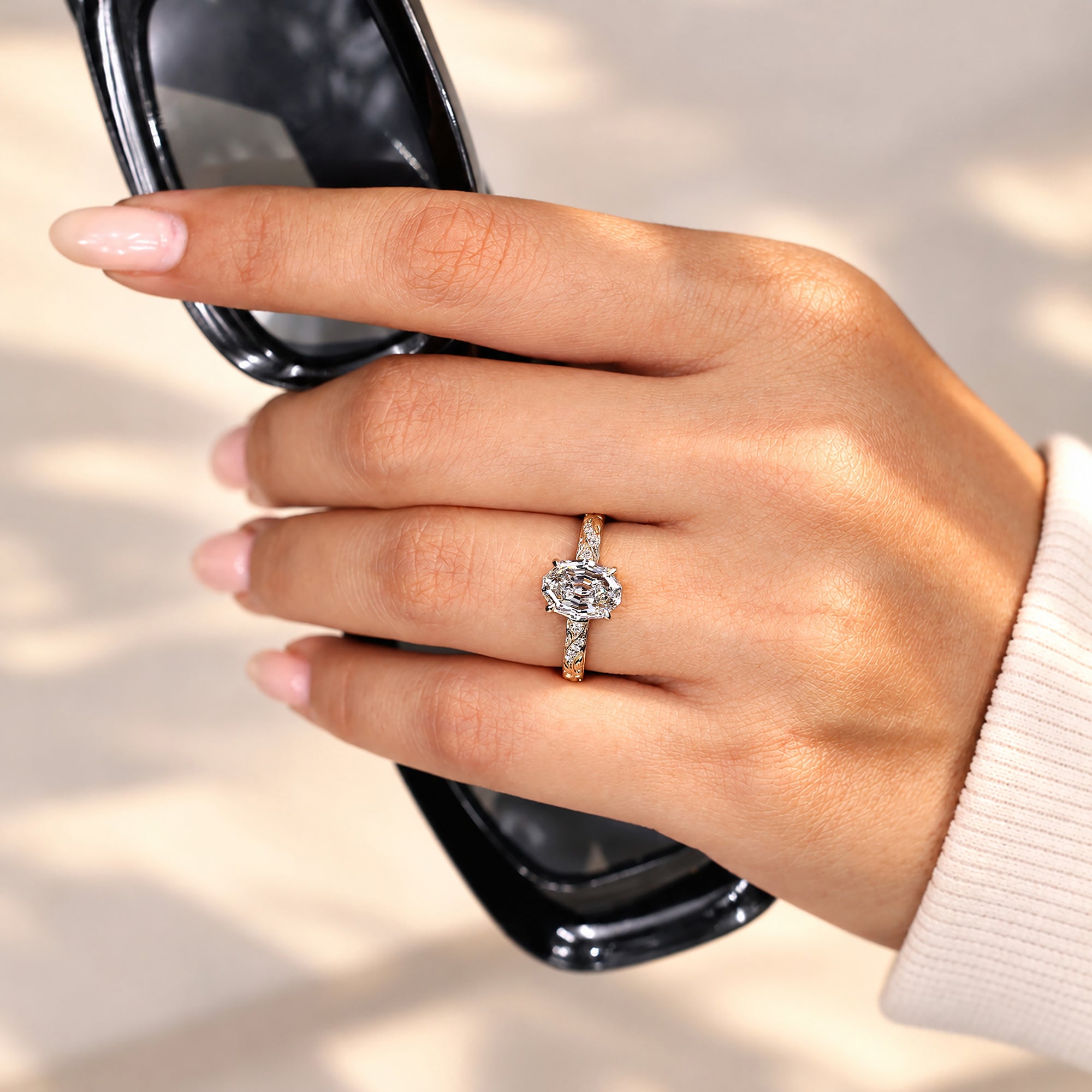Oval step cut lab grown diamond engagement ring
