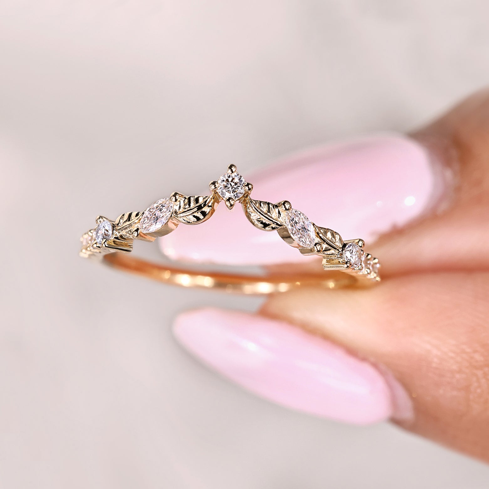 Art deco wedding band with marquise diamond curved design
