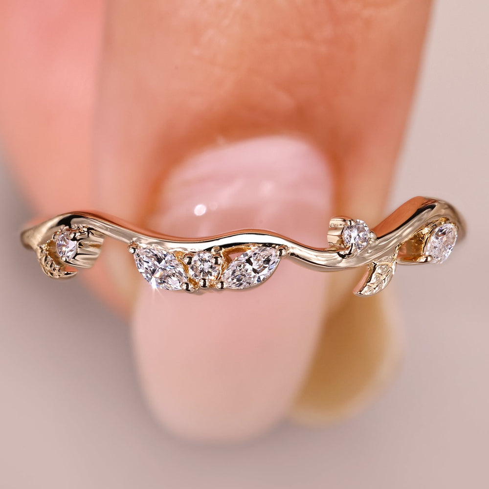 Nature inspired wedding band with round and marquise diamonds.