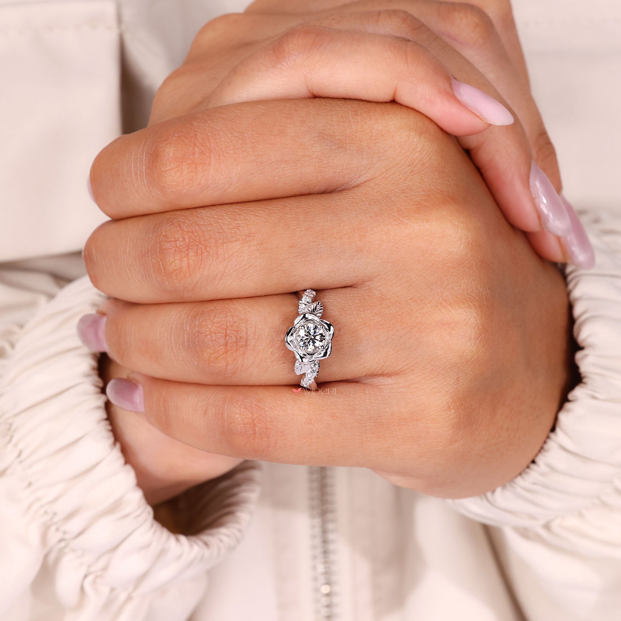 Lab-grown round diamond engagement ring with twisted pave band.
