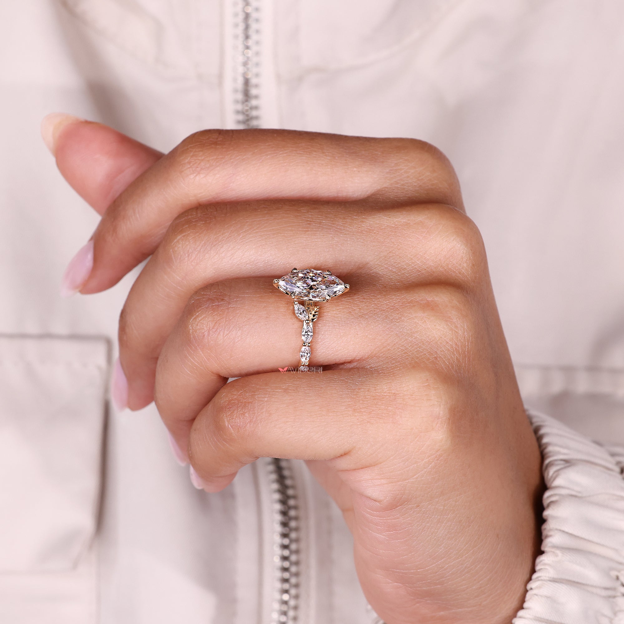 Marquise diamond ring with cathedral setting.
