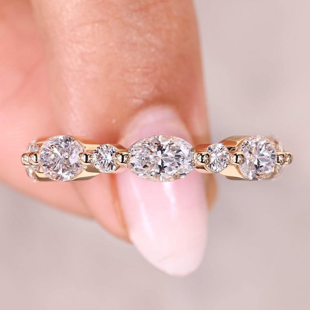 Oval and round diamond half eternity wedding band.
