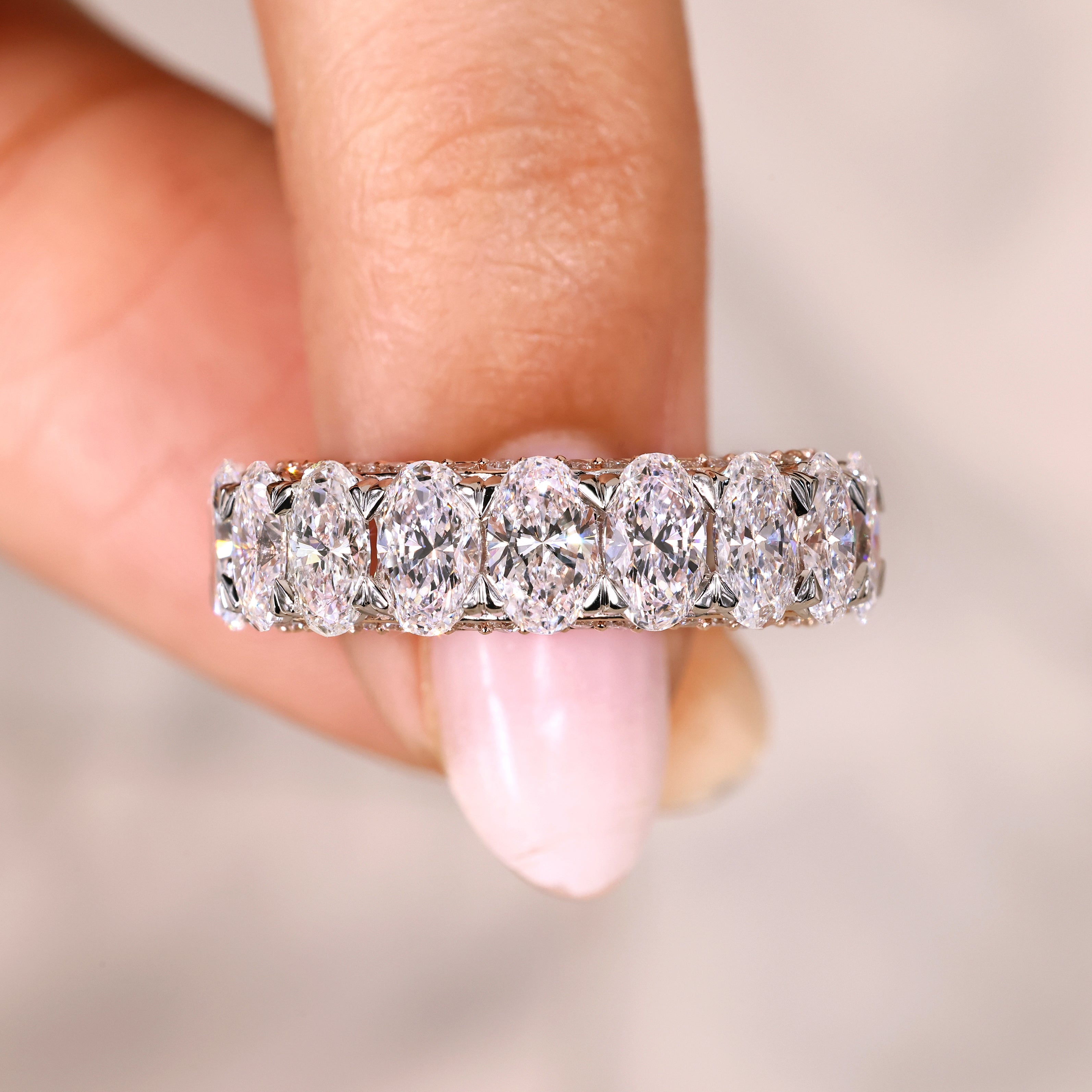 Oval cut diamond band three row pave eternity.
