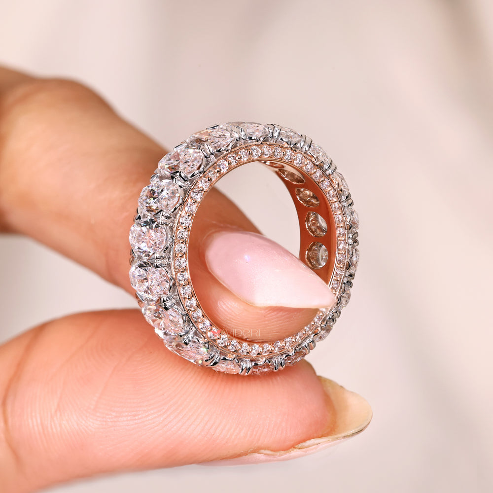 Three row pave oval diamond band heart prong.
