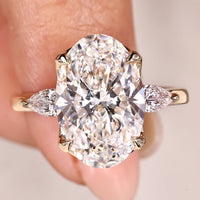 IGI Certified 5 Carat Oval Cut Diamond Ring in Three Stone Style