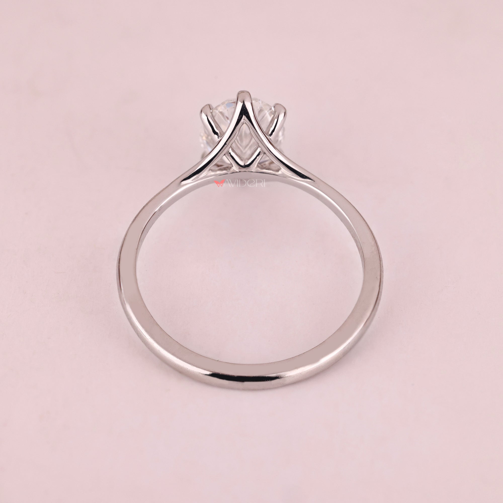 White gold solitaire ring featuring lab grown oval diamond.