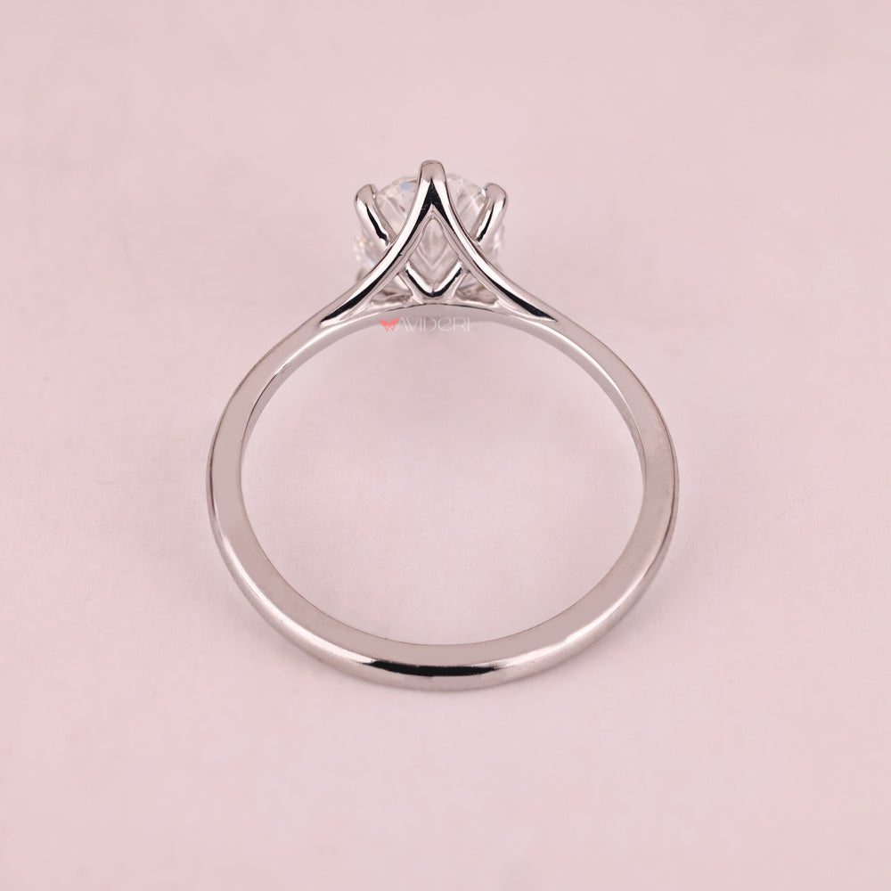 White gold solitaire ring featuring lab grown oval diamond.