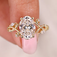 Nature Inspired Oval Cut Diamond Ring With Marquise Side Stone