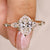 Oval cut diamond ring with pear round side stones.

