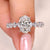 Oval cut diamond ring pave style with round stones.
